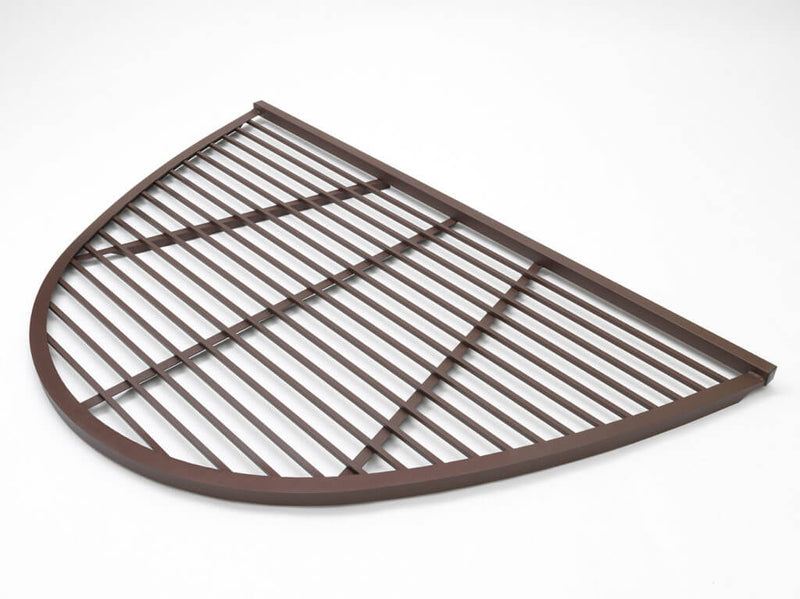 Brown semi-circular metal grate against a white background. The grill features parallel bars and sturdy construction, conveying durability and functionality.